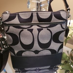 black coach cross body purse.